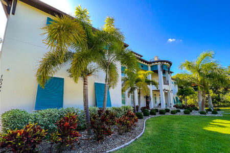Full Window Bahama Shutters And Louvers On Tropical Trail Residence