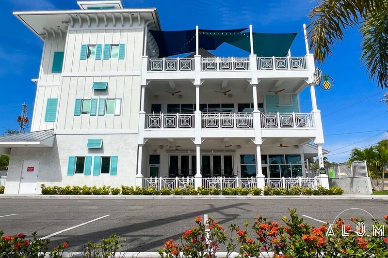 Pineapples EGAD White Aluminum Pineapple Detail Railings and Bahama Shutters