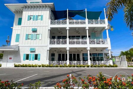 Pineapples EGAD White Aluminum Pineapple Detail Railings and Bahama Shutters